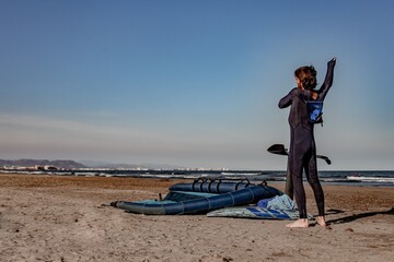 wing foil old kiter on the beach