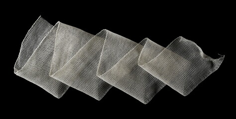 Medical bandage roll isolated on black 