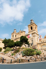 Fototapeta na wymiar City of Malta, Cottonera, at a tourist spot with the Maltese flag.