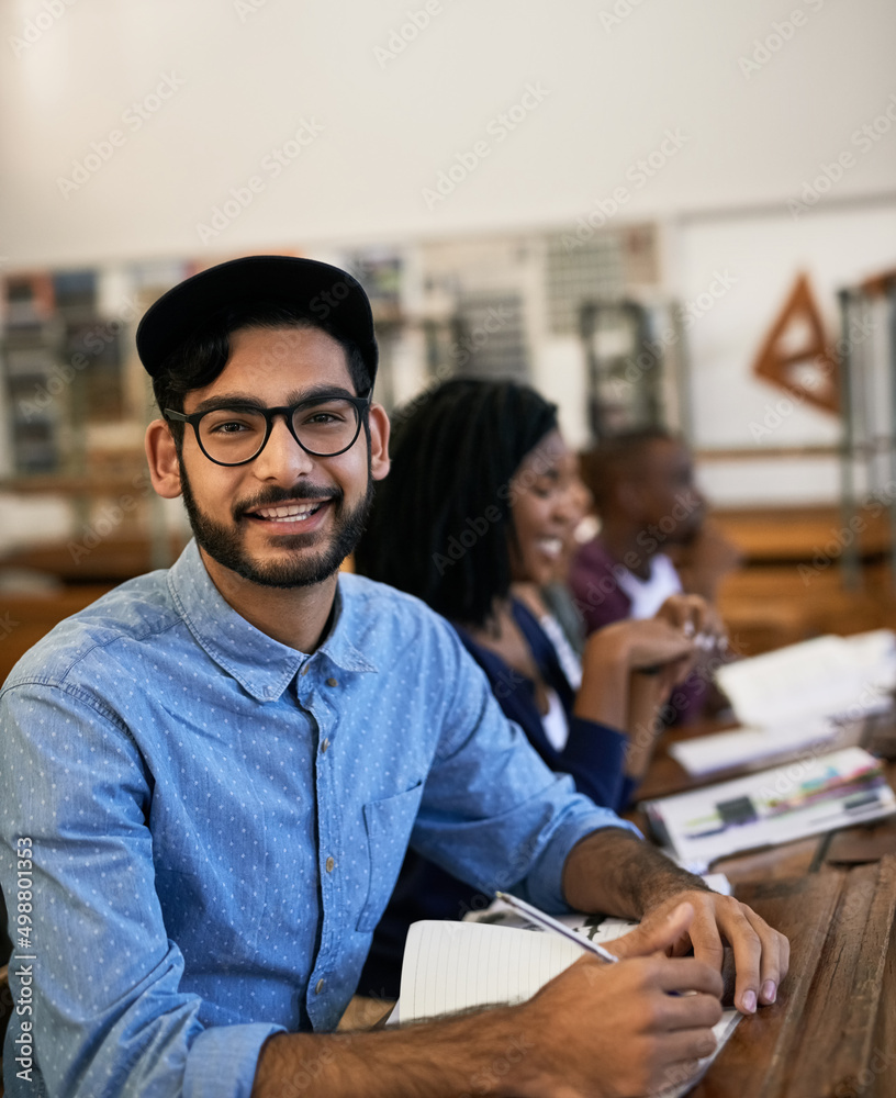 Aufkleber Hes happy about the task they received. Portrait of an university student sitting in class.