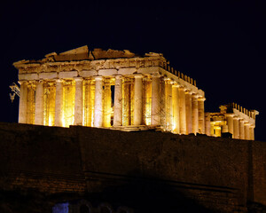 Naklejka premium Parthenon ancient temple on Acropolis of Athens illuminated under the night sky. A rare photo of the temple without scaffolding.