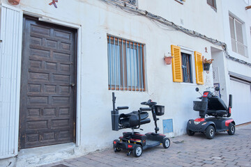 Electric scooters for disabled people ride in Mojacar, Spain