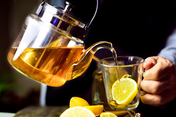 teapot with tea and lemon