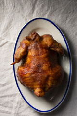 Ruddy baked chicken on a plate