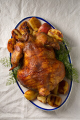 Ruddy baked chicken with apples and herbs