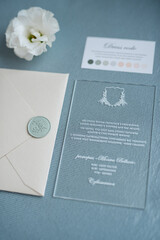 wedding invitation in a gray envelope on a table