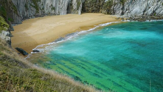 Covachos Beach and Castro Island. Flysch and beach in La Arnia. Cliffs of Liencres. Municipality of Pi&eacute;lagos in the Autonomous Community of Cantabria, Spain, Europe