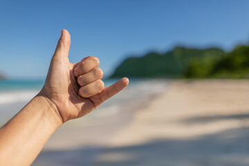 Shaka hang loose hand sign. Hawaii beach vacation.