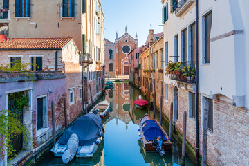 Morning in Venice, water channels along residential buildings, cityscape