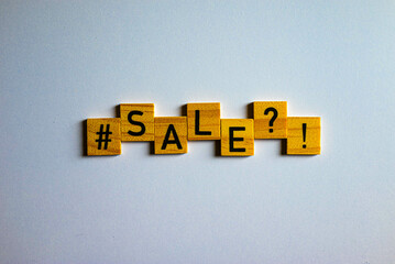 Sale word on wooden blocks with black letters for special and seasonal sale moments. Ideal shot for retailers and internet shops. Also great shot for bloggers. Seasonal sales.
