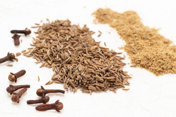 Clove spice buds, fennel seeds and ground coriander.