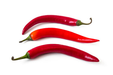 Three pods of hot chili pepper on a white background