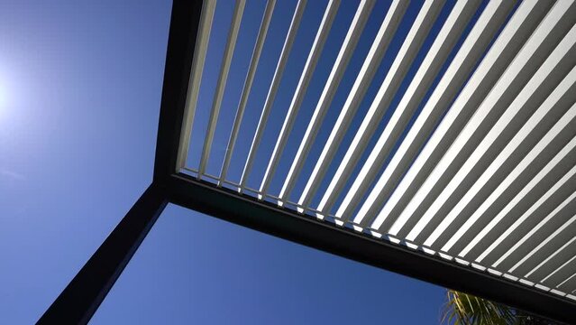 Trendy aluminum outdoor patio pergola. video of rotating blades