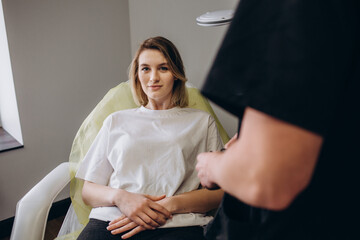 Fototapeta premium Before facial surgery. Rich woman feeling excited before facial surgery after consultation with plastic surgeon