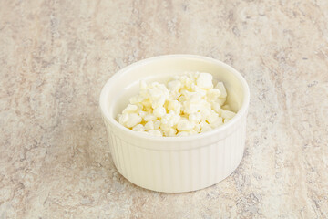 Grained cottage cheese in the bowl