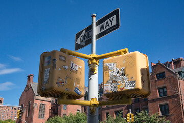 Urban sticker art on traffic lights in New York - Powered by Adobe