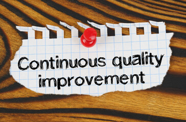 Attached to the board is an announcement with the inscription - Continuous quality improvement