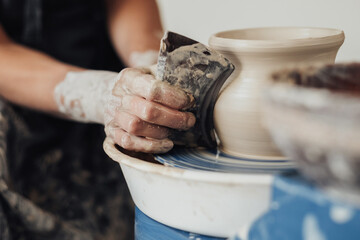 Close Up of Pottery Artist at Work, Potter Master Creating Clay Pot on a Wheel