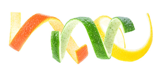Fresh citrus peels isolated on a white background - Lemon, Lime and Orange. Citrus zest spiral.