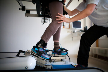 Fototapeta na wymiar Gait training by robotic assistance to facilitate rehabilitation.
