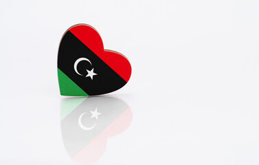 Flag of Libya in the shape of a heart on a white background. The concept of patriotism. copyspace.
