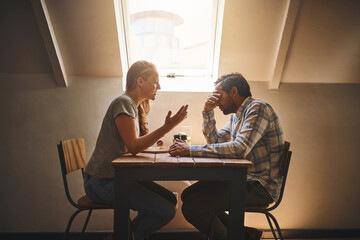 Fototapeta premium Perfect relationships do not exist but true love does. Shot of a couple having a disagreement at a cafe.