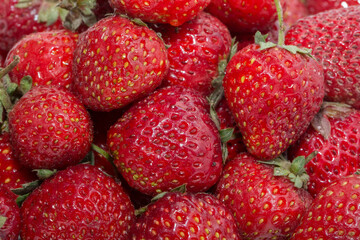 Strawberries as background top view. Strawberries close up. Juicy berries picked for dessert.