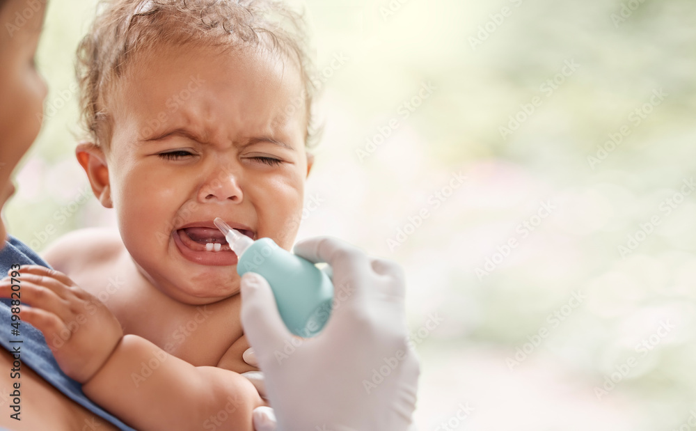 Poster we have to unblock those passages. shot of a doctor using a section tool to relieve a babys phlegm.