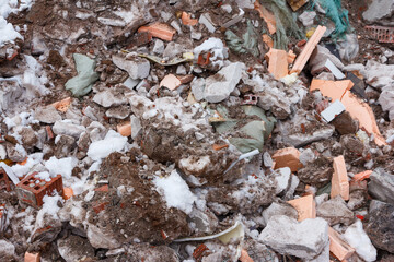 Construction garbage. Pollution. Remains of building materials in a landfill