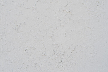 The texture of an old rundown wall with cracks