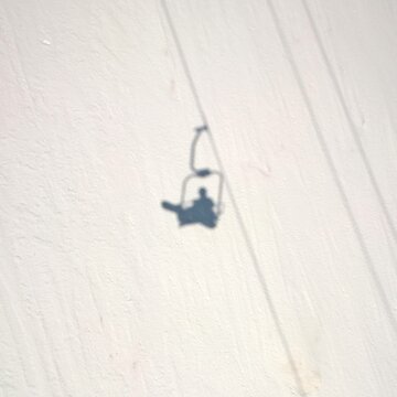 Chair Lift And Shadow