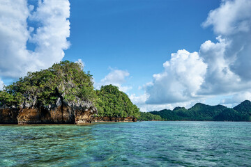 Beautiful landscape with blue sea lagoon and green cliffs, National Park, Siargao Island, Philippines.