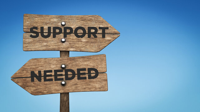 Wooden road signs and support needed text. On blue-colored background. Horizontal composition.