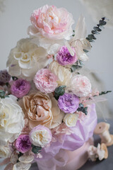 A luxurious bouquet of flowers in a hat box. Composition with pink and white flowers and eucalyptus in a round box. Modern Floristry.