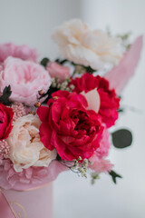 Bouquet of pink peonies a girl for mother's day, valentine's day, Woman's day 8 march. White interior.