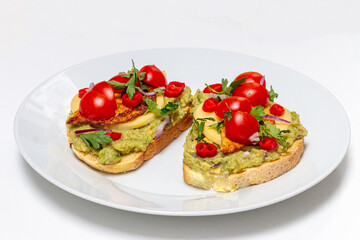 Fototapeta na wymiar Healthy open vegan sandwich with avocado mash, zucchini, cherry tomatoes, cheese on top of corn bread. Healthy food, vegetarian food concept