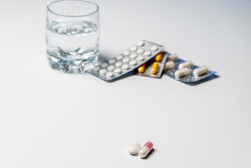 Tablets with a glass of water