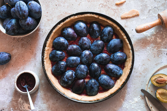 Pie with plum in the making
