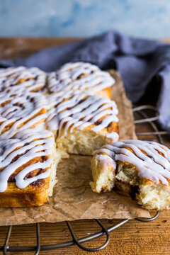 Batch of cinnamon swirl buns with icing