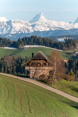 traditional Bernese farmhouse called Stöckli in front of the mighty Schreckhorn