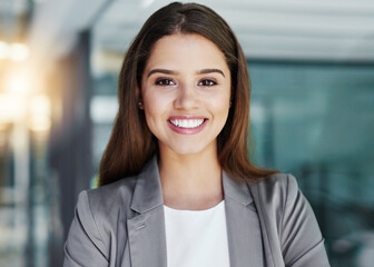 Im ready for corporate success. Cropped portrait of an attractive young businesswoman standing in...