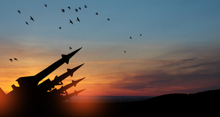 The missiles are aimed at the sky at sunset. Nuclear bomb, chemical weapons, missile defense, a system of salvo fire.