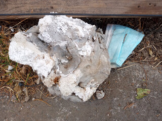Triple layer face masks thrown in the street as medical waste garbage that pollutes the environment...