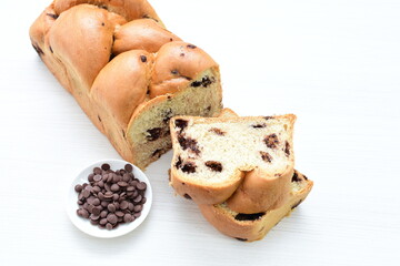 Artisanal bread with a touch of chocolate, displayed on white wood