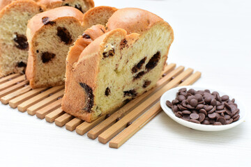 Artisanal bread with a touch of chocolate, displayed on white wood