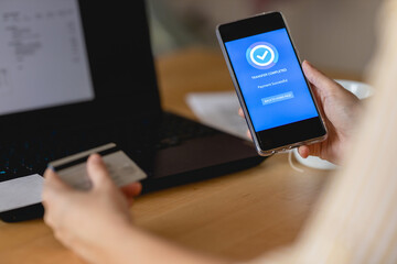 Young woman Paying Bills with mobile phone