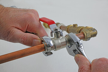 Wrenches, copper pipes and fittings.