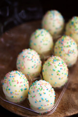 Fototapeta na wymiar Sweet Easter eggs with colorful sprinkles. Easter sweets.