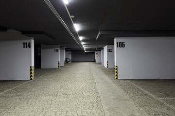 Parking lot of a multi-storey building. Underground parking for residents of a modern house.