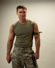 The handsome military man poses for the photo.